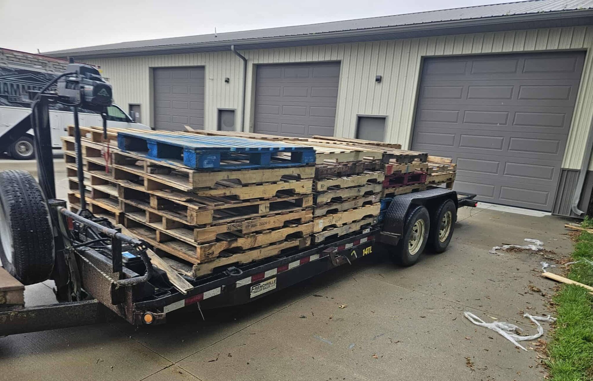 Stacks of pallets loaded for commercial junk removal