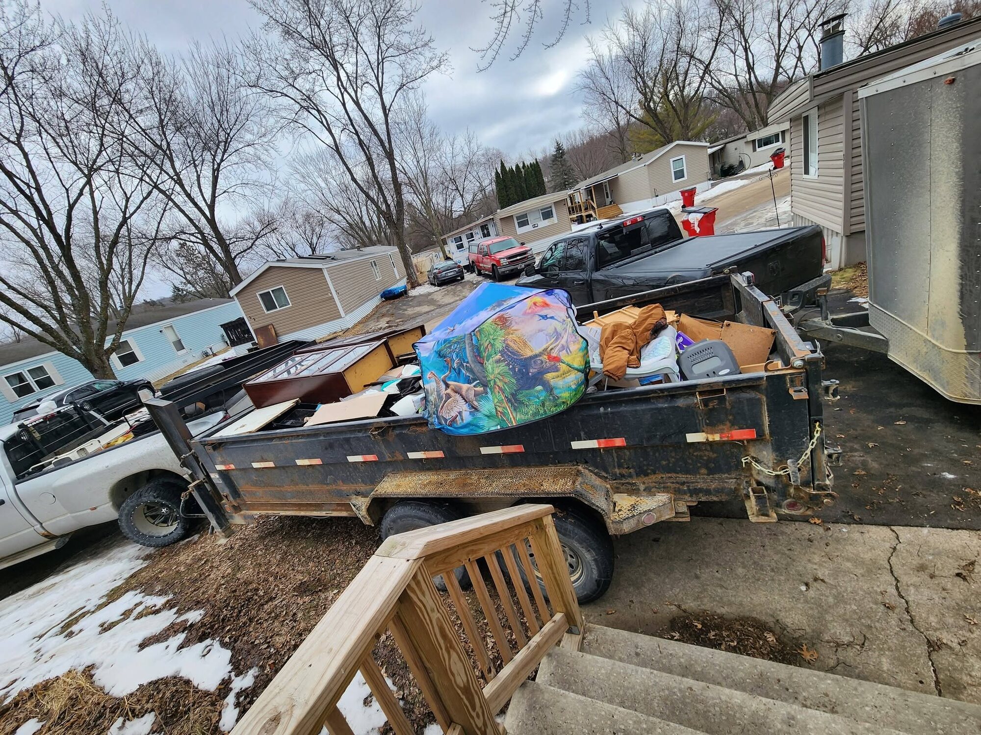 Household furniture and boxes loaded during a residential cleanout