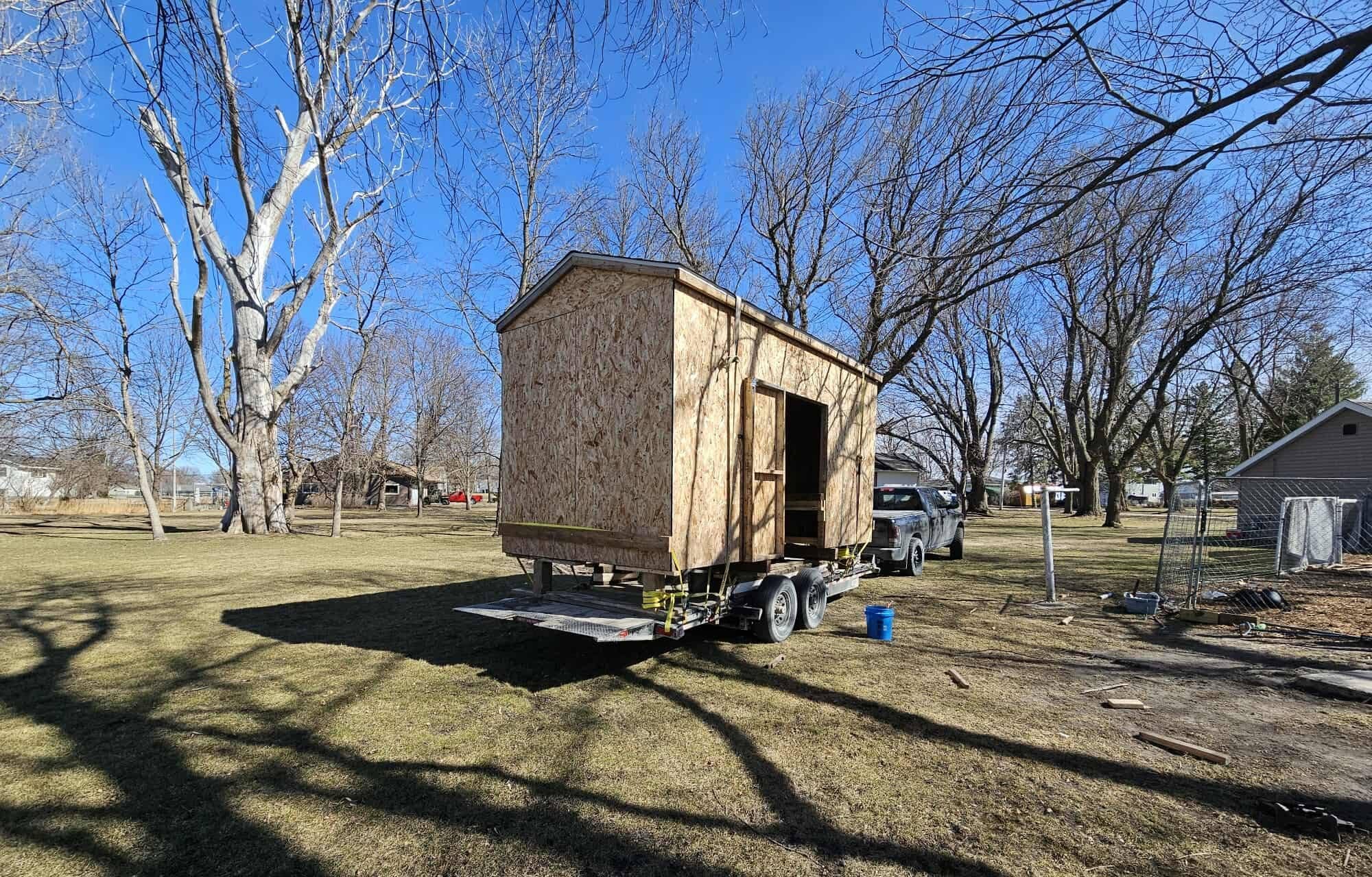 Whole shed loaded on a trailer for removal